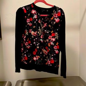 Ted baker floral sweater.top. Floral print on front black on sleeves and back.